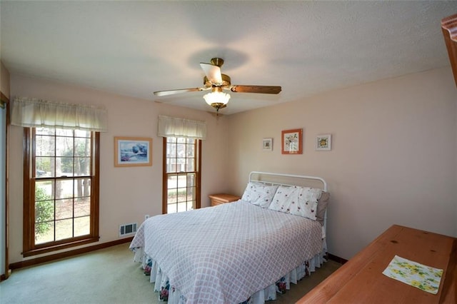 118 Heritage Way, Peachtree City, GA 30269 - bedroom featuring multiple windows, carpet, baseboards, and a ceiling fan