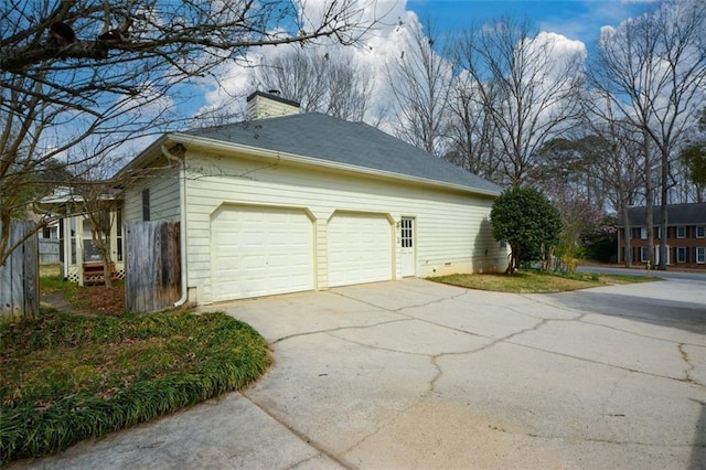118 Heritage Way, Peachtree City, GA 30269 - view of side of property featuring concrete driveway, a chimney, and a garage