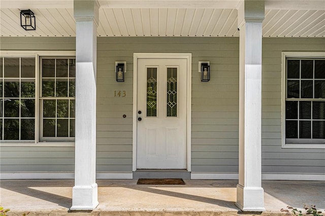 doorway to property with covered porch