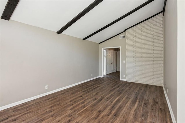 unfurnished living room featuring baseboards, lofted ceiling with beams, wood finished floors, and visible vents
