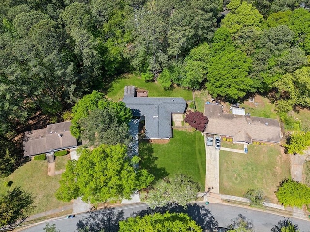 birds eye view of property with a wooded view
