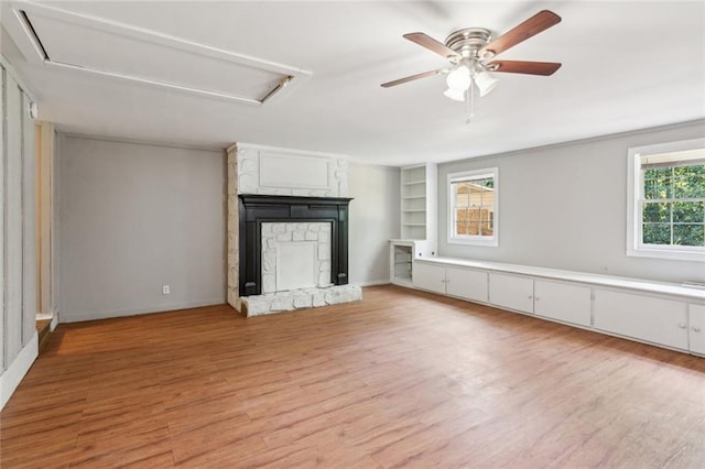 unfurnished living room featuring baseboards, dark wood-style flooring, a brick fireplace, and visible vents
