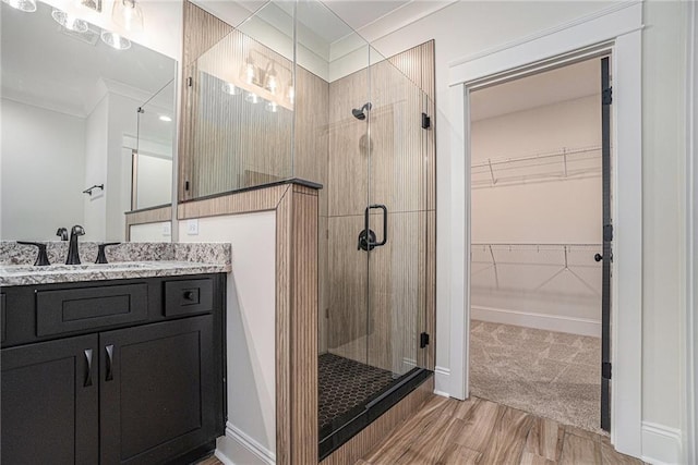 bathroom with walk in shower and vanity