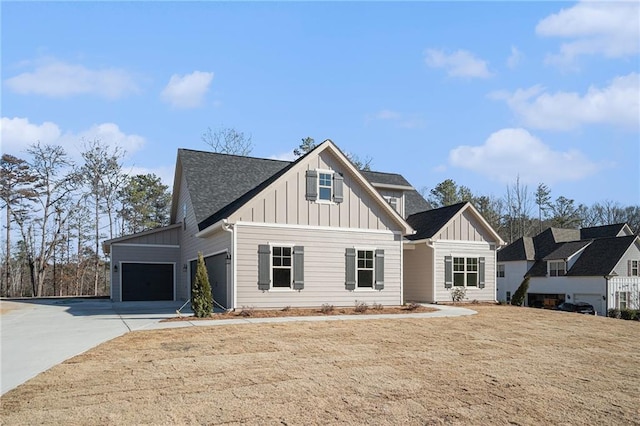 view of front of property with a garage and a front lawn