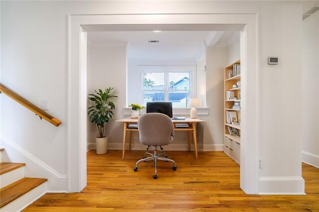 office area with light hardwood / wood-style floors