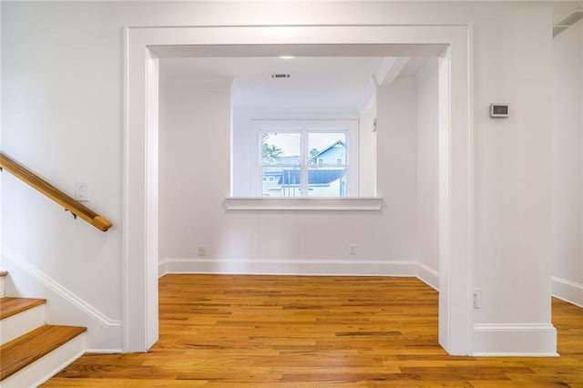 hallway with light hardwood / wood-style flooring