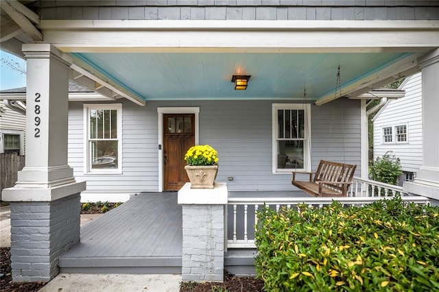 property entrance with covered porch