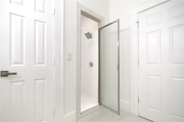 bathroom featuring an enclosed shower