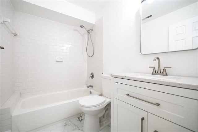 full bathroom featuring vanity, toilet, and tiled shower / bath