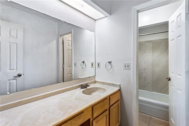 bathroom featuring tile patterned flooring and vanity