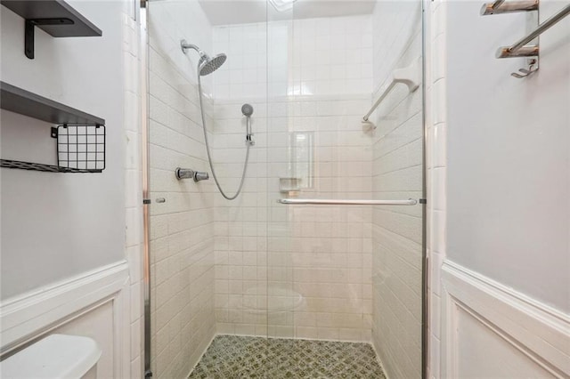 bathroom featuring toilet and walk in shower