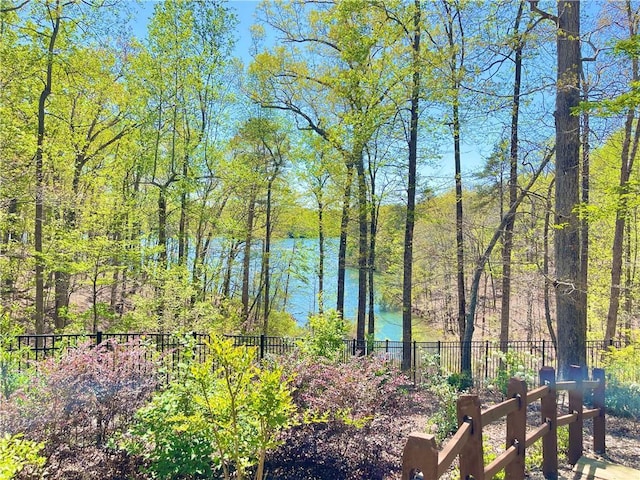 view of water feature with fence