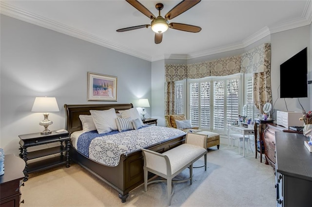 bedroom with ceiling fan, ornamental molding, and light colored carpet