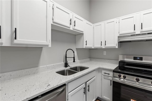 40 Melton Way, Covington, GA 30016 - kitchen featuring appliances with stainless steel finishes, under cabinet range hood, white cabinets, and light stone countertops