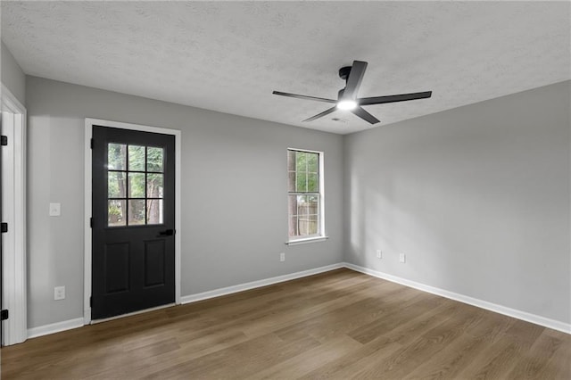 40 Melton Way, Covington, GA 30016 - entryway featuring wood finished floors, ceiling fan, and a textured ceiling