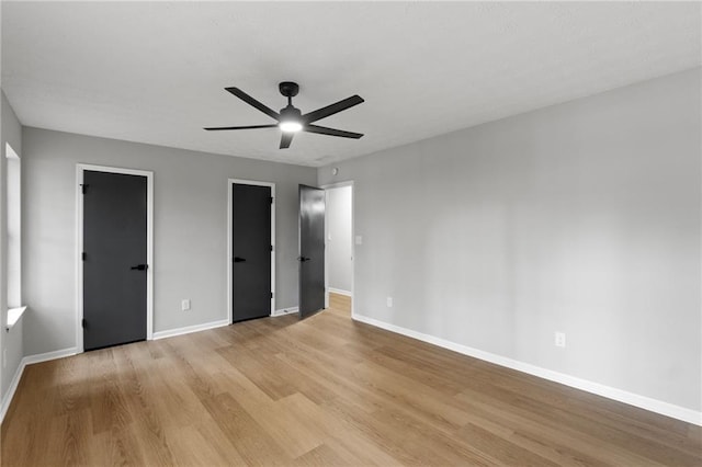 40 Melton Way, Covington, GA 30016 - unfurnished bedroom with light wood finished floors and ceiling fan