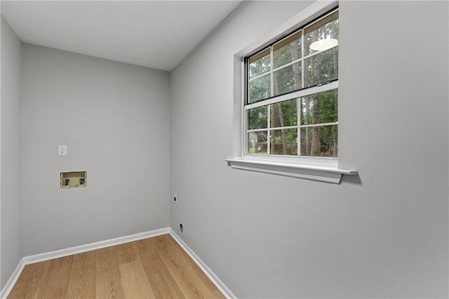 40 Melton Way, Covington, GA 30016 - laundry room featuring hookup for a washing machine, wood finished floors, and electric dryer hookup