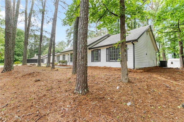 40 Melton Way, Covington, GA 30016 - view of side of property featuring a central air condition unit and a shingled roof