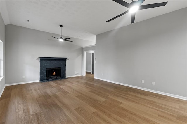 40 Melton Way, Covington, GA 30016 - unfurnished living room with ceiling fan, lofted ceiling, light wood-style flooring, and a fireplace