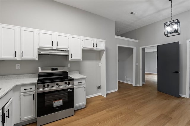40 Melton Way, Covington, GA 30016 - kitchen with electric range, under cabinet range hood, white cabinetry, decorative light fixtures, and light stone countertops