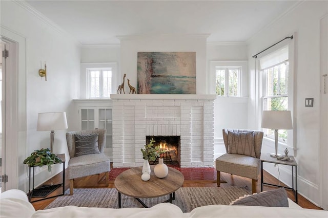 636 Cameron St SE, Atlanta, GA 30312 - living room featuring a brick fireplace, ornamental molding, wood finished floors, and baseboards