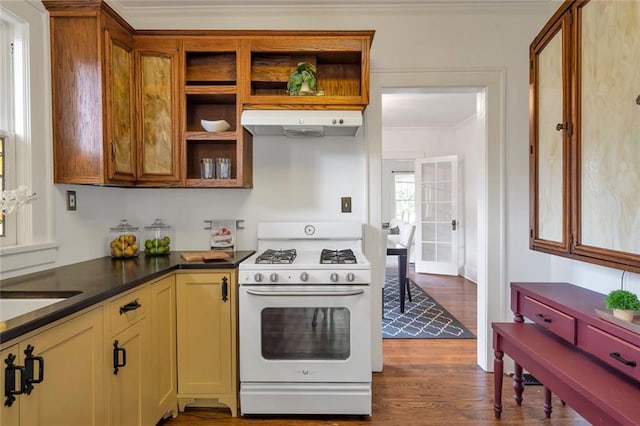 636 Cameron St SE, Atlanta, GA 30312 - kitchen featuring white range with gas stovetop, under cabinet range hood, crown molding, open shelves, and dark wood-style floors