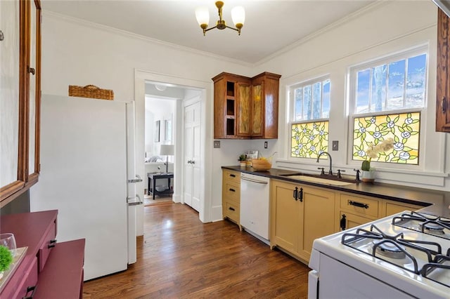636 Cameron St SE, Atlanta, GA 30312 - kitchen with white appliances, a sink, a chandelier, dark countertops, and dark wood finished floors