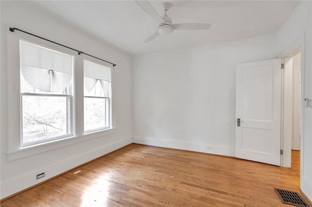 636 Cameron St SE, Atlanta, GA 30312 - empty room with light wood-type flooring, baseboards, and ceiling fan
