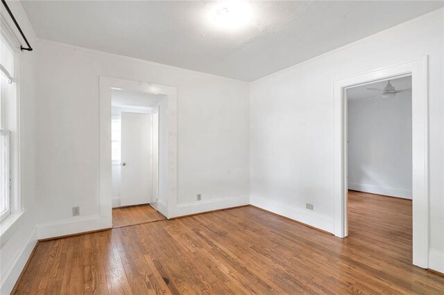 636 Cameron St SE, Atlanta, GA 30312 - empty room with wood finished floors, plenty of natural light, and baseboards