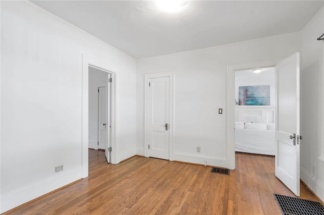 636 Cameron St SE, Atlanta, GA 30312 - unfurnished bedroom featuring wood finished floors and baseboards