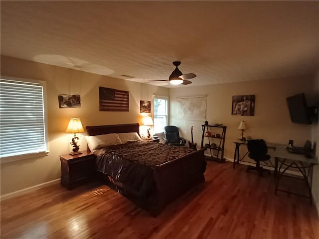 bedroom featuring hardwood / wood-style flooring and ceiling fan