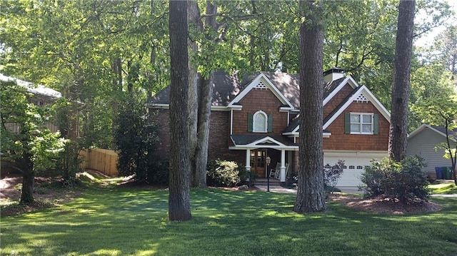 view of front facade with a garage and a front lawn