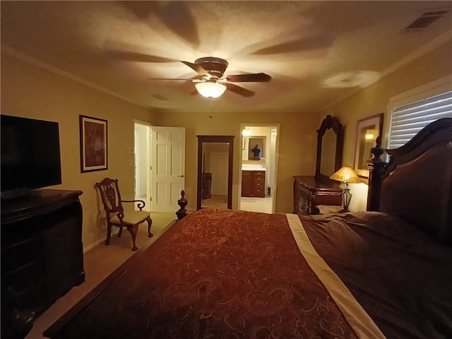 carpeted bedroom featuring ornamental molding, ensuite bathroom, and ceiling fan