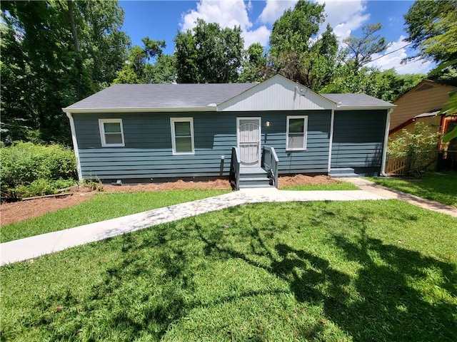 ranch-style home with a front yard