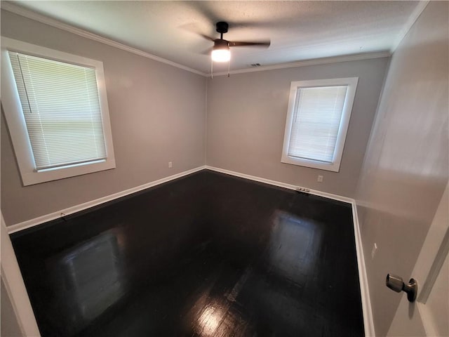 spare room with ornamental molding, hardwood / wood-style floors, and ceiling fan