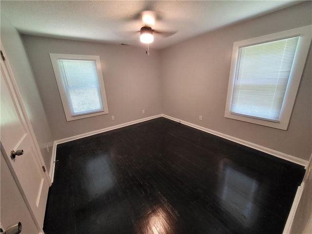 spare room featuring ceiling fan and hardwood / wood-style flooring