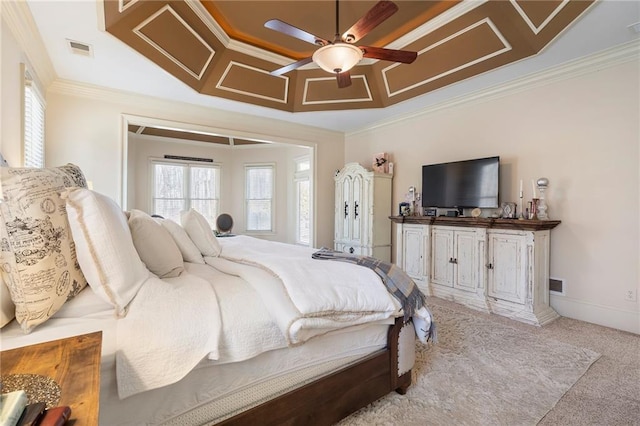 bedroom with visible vents, ceiling fan, baseboards, carpet, and ornamental molding