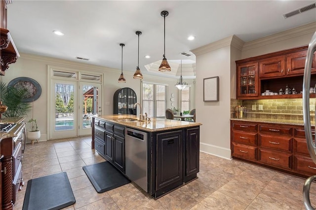 kitchen featuring visible vents, a sink, stainless steel dishwasher, backsplash, and crown molding