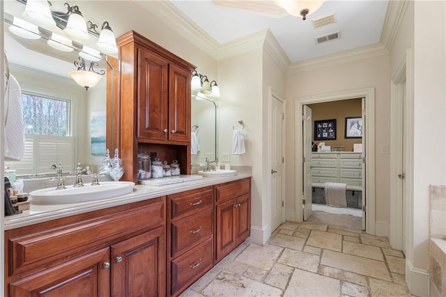 full bathroom with stone tile floors, visible vents, and a sink