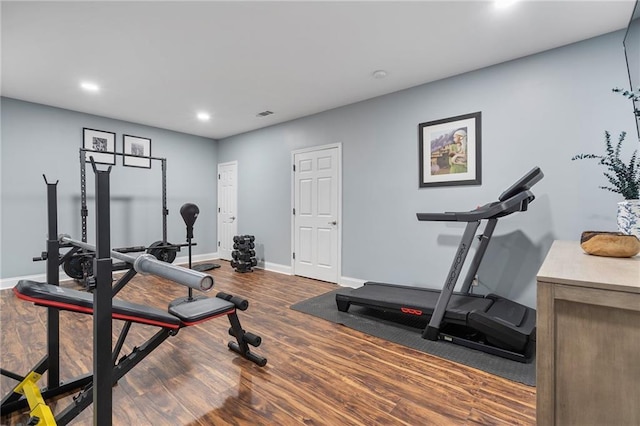 workout area with visible vents, recessed lighting, baseboards, and wood finished floors