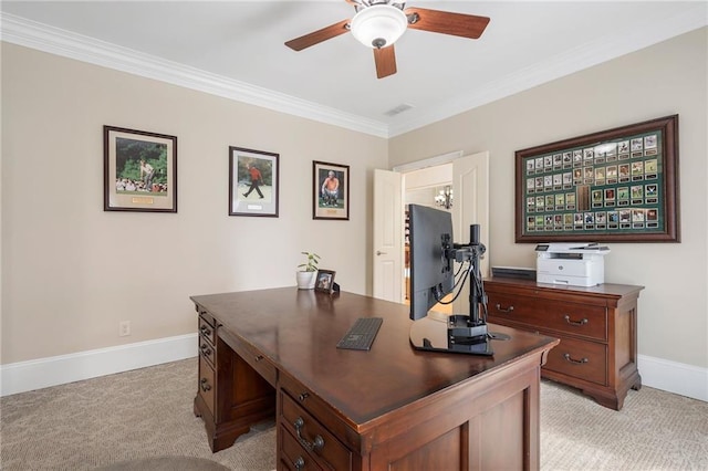 home office featuring baseboards, light carpet, a ceiling fan, and crown molding