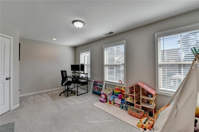 rec room with carpet floors, plenty of natural light, visible vents, and baseboards