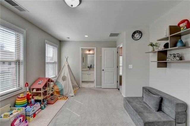 playroom with light carpet, baseboards, visible vents, and recessed lighting