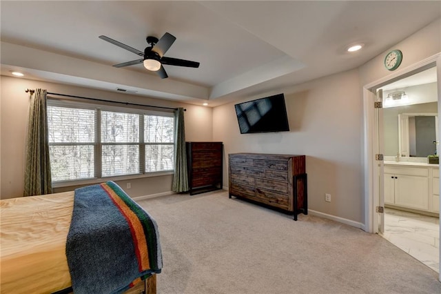 bedroom with ensuite bathroom, recessed lighting, light carpet, visible vents, and baseboards