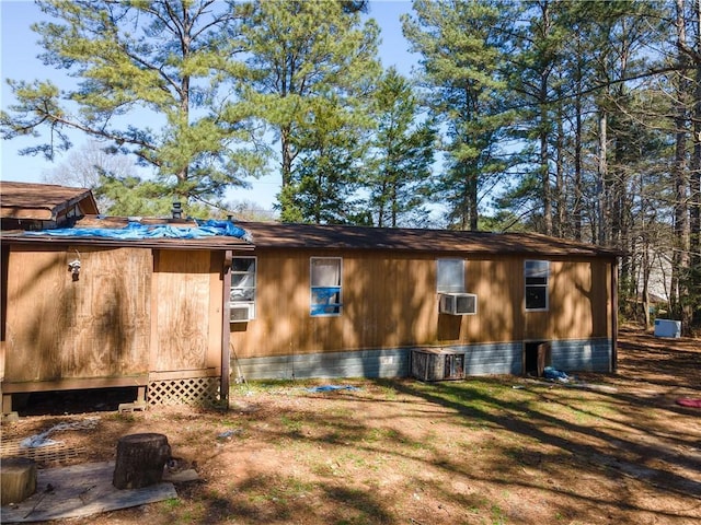 view of side of property with cooling unit