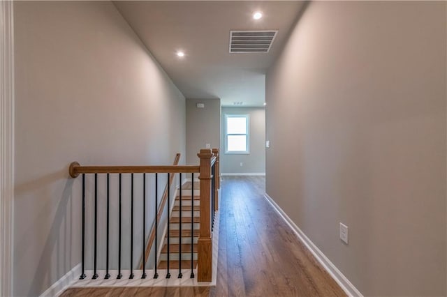 hall with wood-type flooring