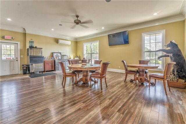 dining space featuring crown molding, a wall mounted air conditioner, hardwood / wood-style floors, and a wealth of natural light