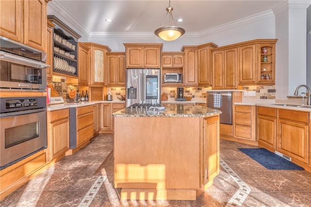 kitchen with tasteful backsplash, crown molding, sink, appliances with stainless steel finishes, and a center island