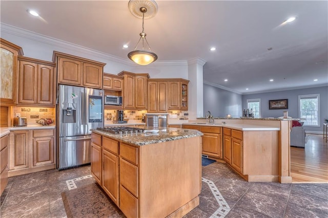 kitchen with pendant lighting, tasteful backsplash, crown molding, stainless steel appliances, and kitchen peninsula