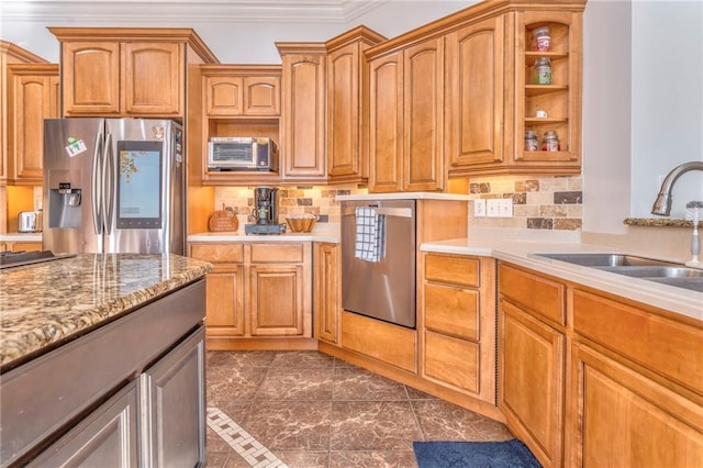 kitchen featuring ornamental molding, sink, stainless steel fridge with ice dispenser, and tasteful backsplash